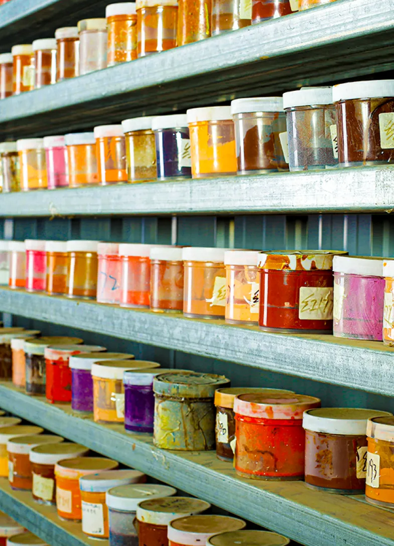 Shelves of many different pots of paints